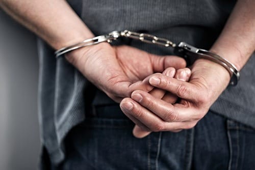 An Arrested Man with Handcuffed Hands | Criminal Defense Law Firm | Law Offices of Clifton Black