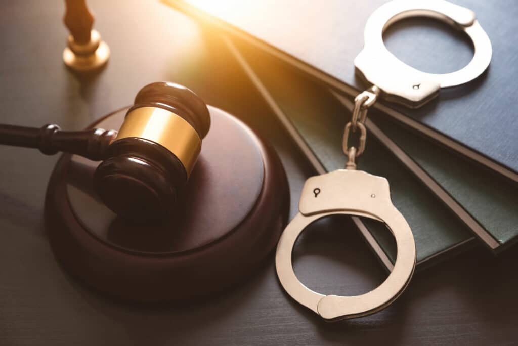 Judge Gavel and Handcuffs | Criminal Defense Law Firm | Law Offices of Clifton Black