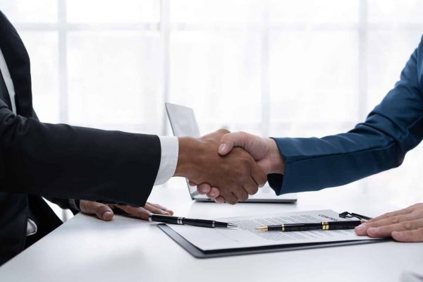 Two Businessmen Shaking Hands | Business Lawyer Colorado Springs | Law Offices of Clifton Black